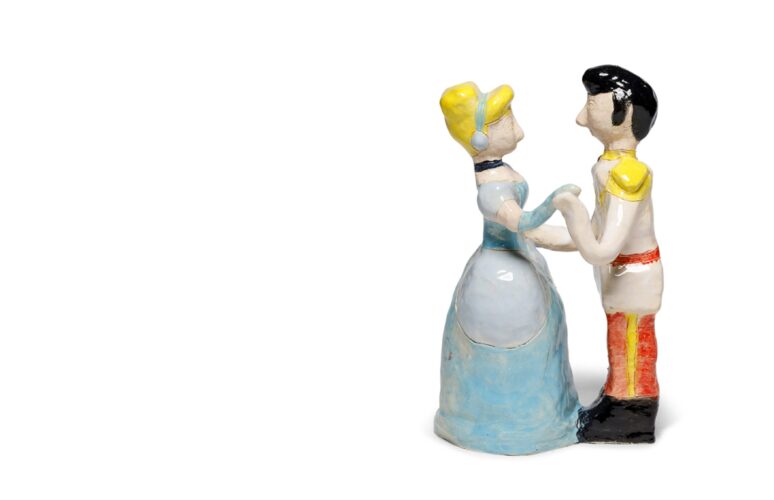 A ceramic sculpture of two people dancing